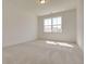 Bright bedroom with carpeted floor and large window at 2193 Blue Bayou Blvd, Johns Island, SC 29455