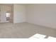 Spacious carpeted bedroom with an open floor plan and access to hallway at 2193 Blue Bayou Blvd, Johns Island, SC 29455