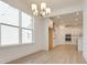 Open concept dining room with kitchen views and hardwood floors at 2193 Blue Bayou Blvd, Johns Island, SC 29455