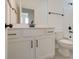 Clean bathroom with white vanity, black accents, and tiled floors at 2193 Blue Bayou Blvd, Johns Island, SC 29455