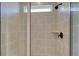 Shower with gray tile and glass enclosure at 2193 Blue Bayou Blvd, Johns Island, SC 29455