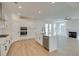 Open kitchen with island, stainless steel appliances, and hardwood floors at 2193 Blue Bayou Blvd, Johns Island, SC 29455