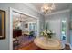 Bright entryway with hardwood floors, chandelier and views into adjacent rooms at 6949 Maybank Hwy, Wadmalaw Island, SC 29487