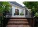 Brick stairs leading up to a deck with black railings at 6949 Maybank Hwy, Wadmalaw Island, SC 29487