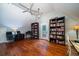 Office or library with hardwood floors, built-in bookshelves and desk at 6949 Maybank Hwy, Wadmalaw Island, SC 29487