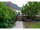 Landscaped backyard with brick pathway leading to the home's back entrance at 6949 Maybank Hwy, Wadmalaw Island, SC 29487