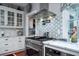 Modern kitchen with stainless steel appliances and marble countertops at 6949 Maybank Hwy, Wadmalaw Island, SC 29487
