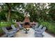 Outdoor brick fire pit with seating area at 6949 Maybank Hwy, Wadmalaw Island, SC 29487