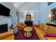 Living room with vaulted ceiling, hardwood floors, fireplace and comfortable seating at 6949 Maybank Hwy, Wadmalaw Island, SC 29487