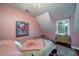 Bedroom with double bed, dresser and floral art at 6949 Maybank Hwy, Wadmalaw Island, SC 29487