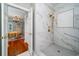 Elegant shower with marble tile and a rainfall shower head at 6949 Maybank Hwy, Wadmalaw Island, SC 29487