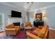 Spacious living room featuring hardwood floors, a fireplace and comfortable seating at 6949 Maybank Hwy, Wadmalaw Island, SC 29487