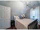 Bedroom with a double bed, nightstand and chandelier at 6949 Maybank Hwy, Wadmalaw Island, SC 29487