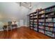 Office or library with hardwood floors, built-in bookshelves and desk at 6949 Maybank Hwy, Wadmalaw Island, SC 29487
