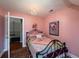 Bedroom with double bed, dresser, and pink walls at 6949 Maybank Hwy, Wadmalaw Island, SC 29487