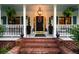 Inviting front entrance with brick steps and elegant lighting at 6949 Maybank Hwy, Wadmalaw Island, SC 29487