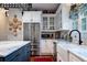 Modern kitchen with stainless steel appliances, white cabinets, and marble countertops at 6949 Maybank Hwy, Wadmalaw Island, SC 29487