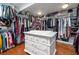 Spacious walk-in closet with custom shelving and island at 6949 Maybank Hwy, Wadmalaw Island, SC 29487