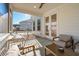 Relaxing screened porch with seating and outdoor table at 2261 Blue Bayou Blvd, Johns Island, SC 29455