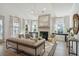 Bright living room with fireplace, hardwood floors, and stylish furniture at 2261 Blue Bayou Blvd, Johns Island, SC 29455