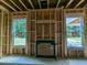 Unfinished Gathering room with a fireplace and two large windows at 120 Palfrey Dr, Ridgeville, SC 29472