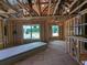 New home framing with exposed rafters and windows, showing progress at 120 Palfrey Dr, Ridgeville, SC 29472