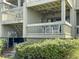 Private deck with seating and ceiling fan, overlooking greenery at 1309 Pelican Watch Villas, Seabrook Island, SC 29455