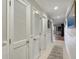Bright hallway with tile flooring and shiplap wall details at 1309 Pelican Watch Villas, Seabrook Island, SC 29455