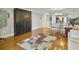 Bright living room with hardwood floors, comfy seating, and a charming dining area at 1309 Pelican Watch Villas, Seabrook Island, SC 29455