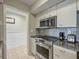 Modern kitchen with stainless steel appliances and granite countertops at 1309 Pelican Watch Villas, Seabrook Island, SC 29455
