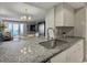 Kitchen with granite countertops, stainless steel sink, and open layout at 1309 Pelican Watch Villas, Seabrook Island, SC 29455