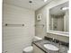 Simple bathroom with granite countertops and shiplap walls at 1309 Pelican Watch Villas, Seabrook Island, SC 29455