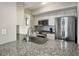 Modern kitchen with granite countertops and stainless steel appliances at 1309 Pelican Watch Villas, Seabrook Island, SC 29455