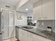 Modern kitchen with stainless steel appliances and granite countertops at 1309 Pelican Watch Villas, Seabrook Island, SC 29455