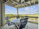 Deck with table and chairs offering scenic water views at 1309 Pelican Watch Villas, Seabrook Island, SC 29455