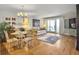Living room with hardwood floors, comfortable sofa and access to deck at 1309 Pelican Watch Villas, Seabrook Island, SC 29455