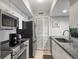 Modern kitchen with stainless steel appliances and granite countertops at 1309 Pelican Watch Villas, Seabrook Island, SC 29455