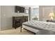 Comfortable bedroom with a bed, dresser, and mounted TV at 1309 Pelican Watch Villas, Seabrook Island, SC 29455