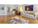 Spacious living room with hardwood floors, comfortable seating and large artwork at 1309 Pelican Watch Villas, Seabrook Island, SC 29455