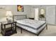 Bright bedroom with a comfortable bed, nightstand, and neutral decor at 1309 Pelican Watch Villas, Seabrook Island, SC 29455
