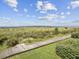 Beach access via a scenic boardwalk with lush landscaping at 1309 Pelican Watch Villas, Seabrook Island, SC 29455