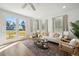 Relaxing living room features a white couch, natural light and patio access at 229 Abercom Place Dr, Moncks Corner, SC 29461