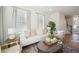 Cozy living room with white couch, wood accents and large windows at 229 Abercom Place Dr, Moncks Corner, SC 29461