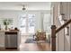 Open living room and kitchen with French doors leading to backyard at 229 Abercom Place Dr, Moncks Corner, SC 29461