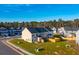 Aerial view of a townhome with a backyard and wooden fence in a new development at 229 Abercom Place Dr, Moncks Corner, SC 29461