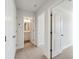 Upstairs hallway with neutral walls and carpeted floors and bedrooms at 229 Abercom Place Dr, Moncks Corner, SC 29461
