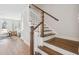Wooden staircase with white spindles and hardwood floors at 229 Abercom Place Dr, Moncks Corner, SC 29461