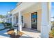 Townhome front porch with white columns and a dark brown door at 229 Abercom Place Dr, Moncks Corner, SC 29461