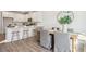 Bright dining area with wood table and seating for six, adjacent to kitchen at 229 Abercom Place Dr, Moncks Corner, SC 29461