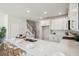 White kitchen with marble countertops, gold fixtures and wood flooring at 229 Abercom Place Dr, Moncks Corner, SC 29461